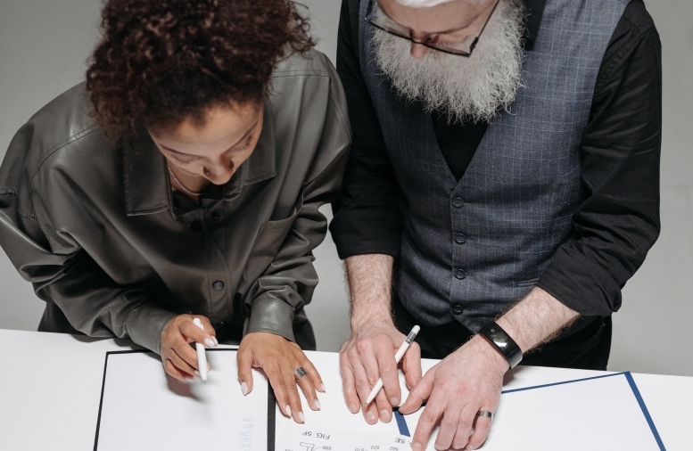 man and woman in meeting